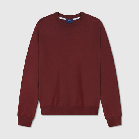 The Anytime Crewneck Sweater in Maroon folded on a plain background