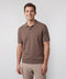 A man wearing the Legacy Resort Polo in Mocha Heather.