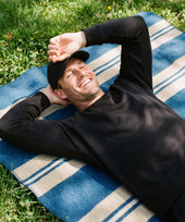 A man wearing the Sandwash Crewneck in True Black.