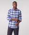 A man wearing the Anytime Plaid Shirt in Navy Classic Plaid
