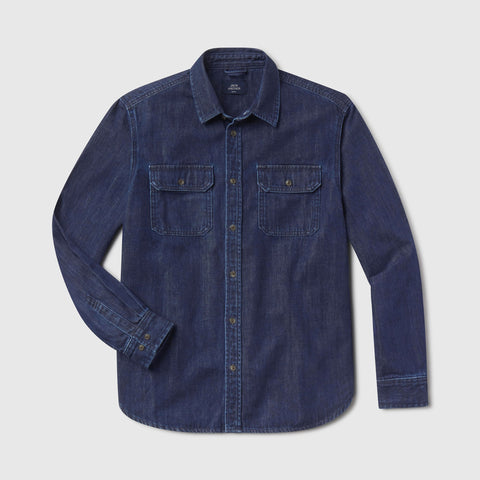 A man in the Chambray Shirt, Dark Wash, seated