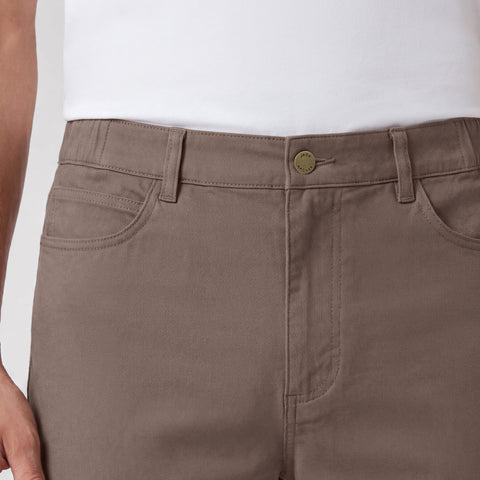 A man wearing Charter Twill Pant in Deep Taupe in a lifestyle setting.
