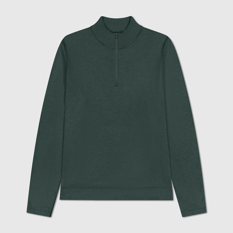 A man wearing the Clubhouse Range Quarter-Zip in Alpine Green in motion