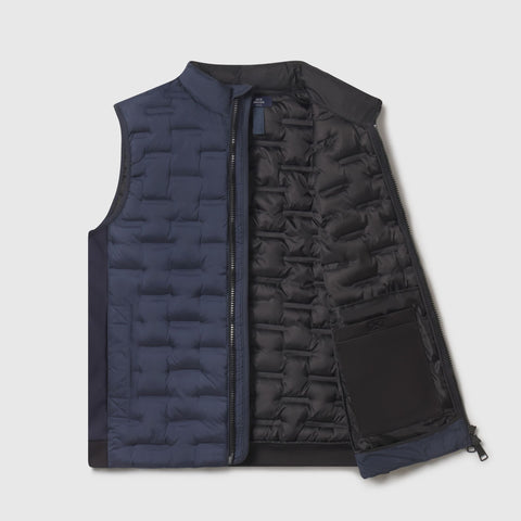 Deep blue quilted Drive vest laid open to show the black lining and an interior pocket.