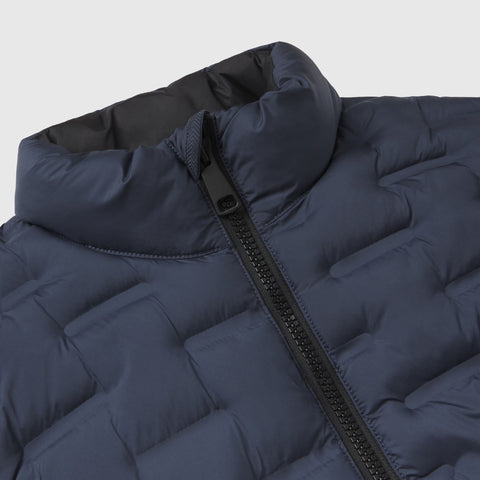 Close-up of the collar, zip pull and box quilting on the deep blue Drive vest.