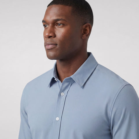 The Everywear Shirt Standard Length in Chambray Blue, folded flat on a neutral background.