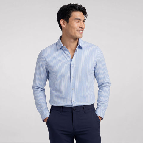 A man wearing the Everywear Shirt Standard Length in Fine Stripe with a button-down collar.