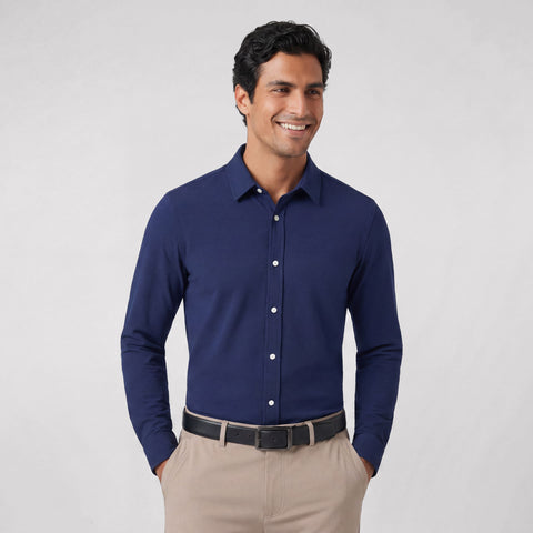 A man wearing the Everywear Shirt Standard Length in Navy with a button-down collar.