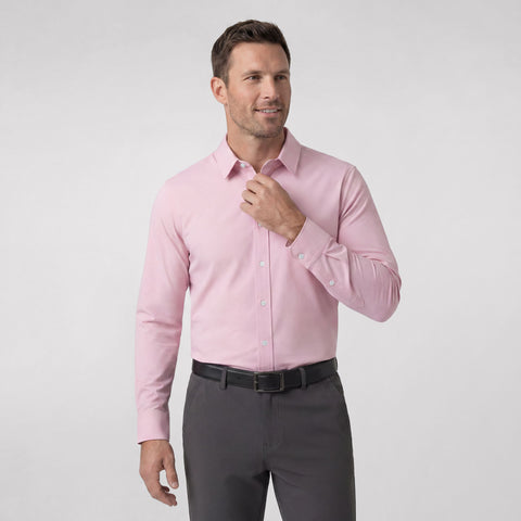 A man wearing the Everywear Shirt Standard Length in Soft Rose with a button-down collar.