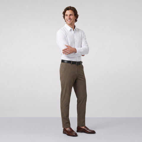 A secondary view of a man in the Everywear Shirt Standard Length in True White.