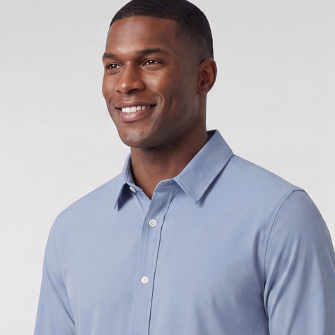 The Everywear Shirt Shorter Length in Chambray Blue, folded flat on a neutral background.