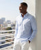 The Everywear Shirt Shorter Length in Fine Stripe worn in a lifestyle setting.
