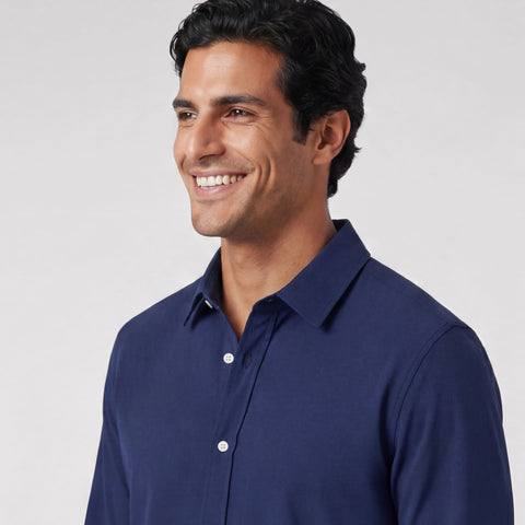 The Everywear Shirt Shorter Length in Navy, folded flat on a neutral background.