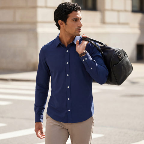 The Everywear Shirt Shorter Length in Navy worn in a lifestyle setting.