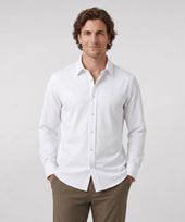 A man wearing the Everywear Shirt Shorter Length in True White with a classic fit.