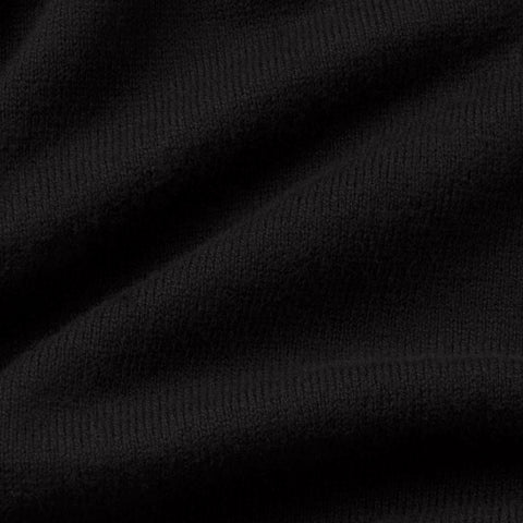 Close-up of the fine black knit fabric.