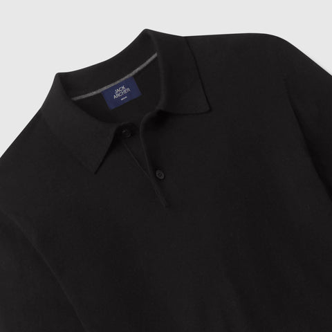 Close-up of the collar and two-button placket on a black knit long-sleeve polo.