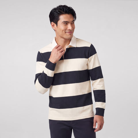A man wearing the Rugby Polo in Cream and Dark Navy