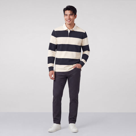 Alternate angle of a man in the Rugby Polo, Cream and Dark Navy