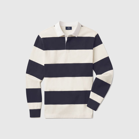 The Rugby Polo in Cream and Dark Navy, laid flat on white
