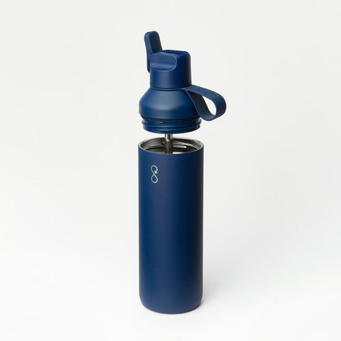 A navy insulated bottle with the lid lifted away to show the steel straw inside.