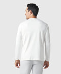 Precision Long Sleeve Tee in white organic cotton, hypoallergenic and wrinkle-resistant, viewed from the back worn by a model.
