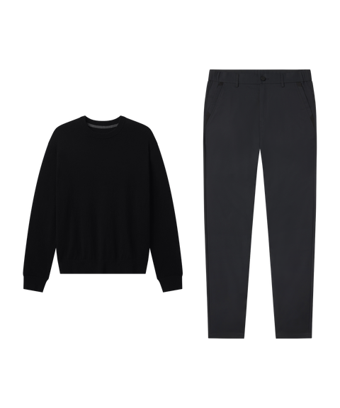 Travel outfit flat lay: Anytime Crewneck Sweater in True Black paired with charcoal pants