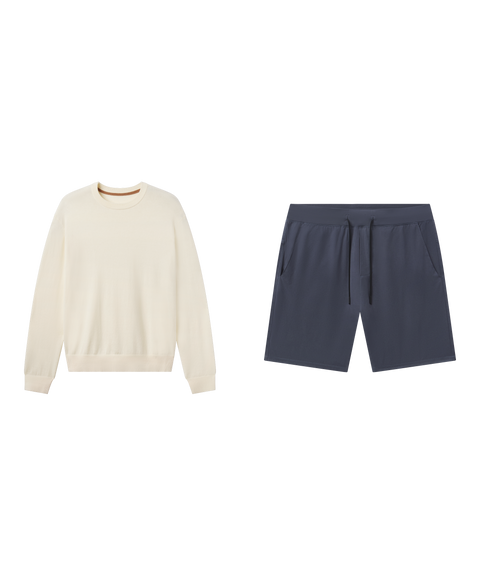 Travel outfit flat lay: cream crewneck sweater with Atlas Short 8 inch in Slate Blue