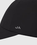 Black Anytime Hat with waterproof material and adjustable velcro strap.
