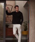 Precision Long Sleeve Tee in black, crafted from soft organic cotton, emphasizing shoulders for a tailored fit.