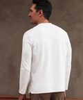 Precision Long Sleeve Tee in white organic cotton, shown from the back on a male model.