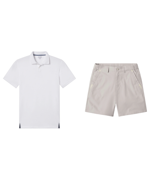 White pique polo laid flat beside light stone shorts.