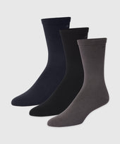 Three pairs of premium Pima cotton Anytime Socks in black, dark blue, and gray, designed for comfort and durability.