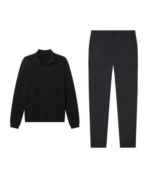 Travel outfit flat lay: Jetsetter Quarter-Zip Sweater in True Black paired with black pants