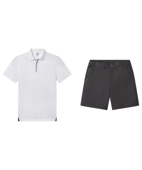 White textured polo with navy placket trim paired with charcoal gray shorts, shown flat.