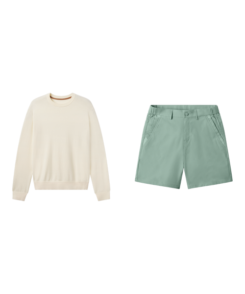 Travel outfit flat lay: cream crewneck sweater with Jetsetter Tech Short 7 inch in Sage Green