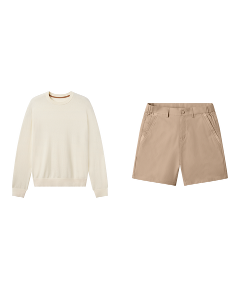 Travel outfit flat lay: cream crewneck sweater with Jetsetter Tech Short 7 inch in Sand Tan