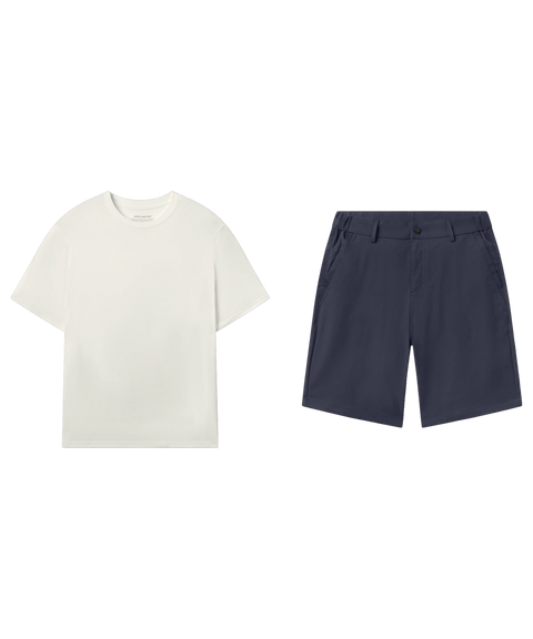 Ivory crewneck tee paired with navy flat-front shorts, shown flat.