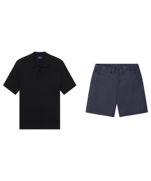 Black knit polo paired with navy tech shorts.