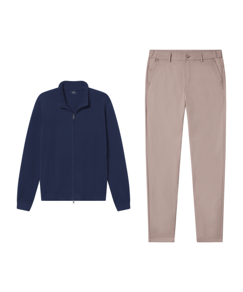 Navy full-zip sweater paired with taupe chino pants.