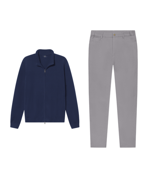 Navy full-zip sweater paired with grey five-pocket pants.