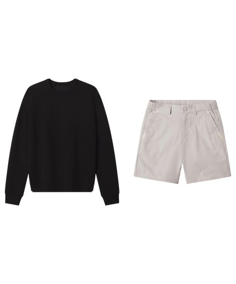 Black crewneck sweatshirt paired with stone grey tech shorts.