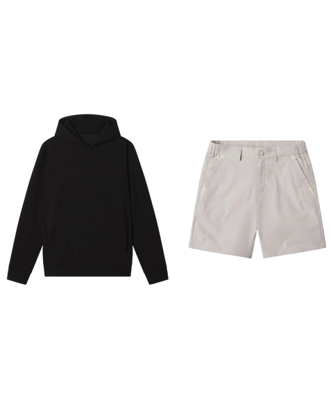 Black hooded sweatshirt paired with stone grey tech shorts.