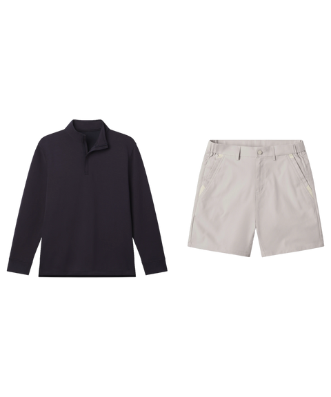 Navy quarter-zip pullover paired with pale grey shorts, shown flat.